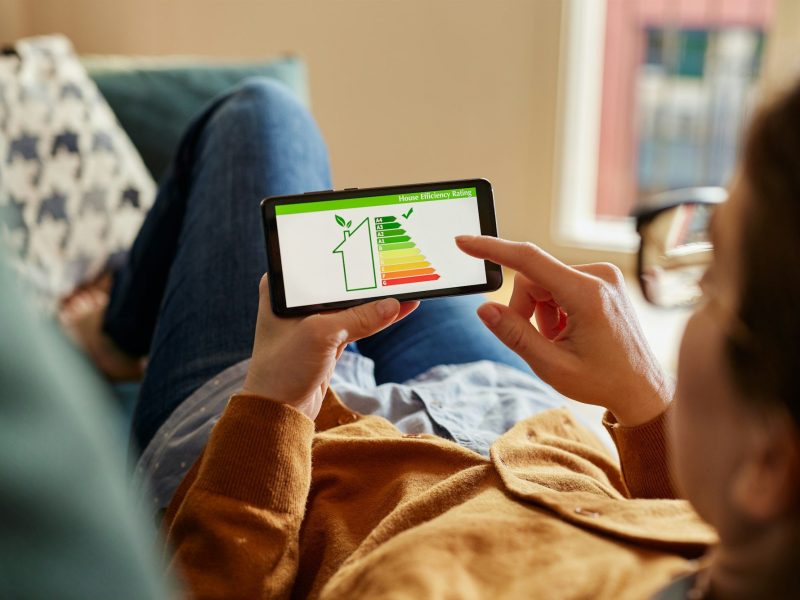 Girl checking the energy efficiency of her home